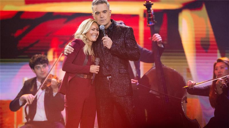 ZDF-Weihnachtsshow: Helene Fischer und der doppelte Florian Silbereisen Sängerin Helene Fischer und der britische Sänger Robbie Williams stehen bei der Aufzeichnung der Helene-Fischer-Show auf der Bühne.